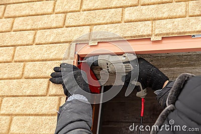 Installation of the gate in the garage metal Stock Photo