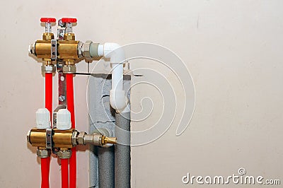 Installation individual of home heating. Connecting pipe warm water floor to the manifold heating. Stock Photo