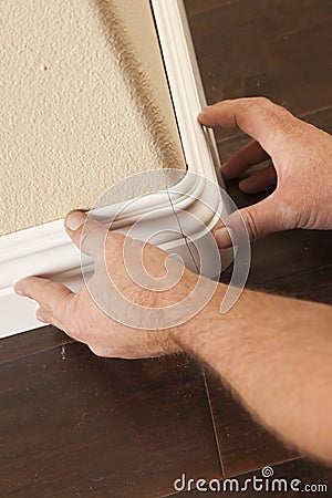 Installation of New Baseboard Bull Nose Cornerns Stock Photo