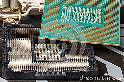 Installation of processor into a socket on computer mainboard Stock Photo