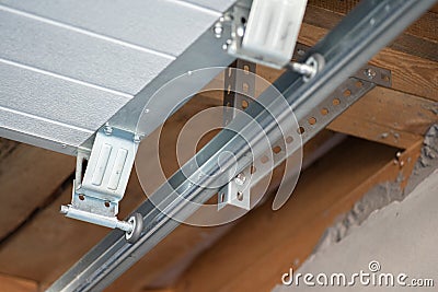 Installation of the rollers for the automatic garage door Stock Photo