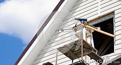 Installation of a siding on a house against the sky Stock Photo