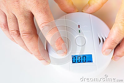Installation of a smoke and fire alarm with carbon monoxide sens Stock Photo