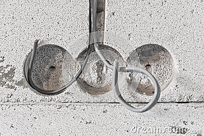 Elecrician work. Installing wall electric outlet Stock Photo