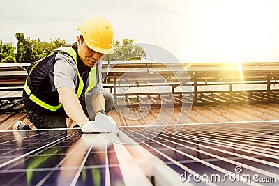 Installation of solar panels and inspecting them by engineers. Stock Photo