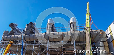 Installation using a concrete structure crane. View from below. The concept of construction of complex metal concrete structures Stock Photo