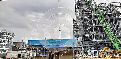 Installation using a concrete structure crane. View from below. The concept of construction of complex metal concrete structures Stock Photo
