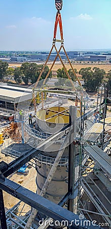 Installation using a concrete structure crane. View from below. The concept of construction of complex metal concrete structures Stock Photo