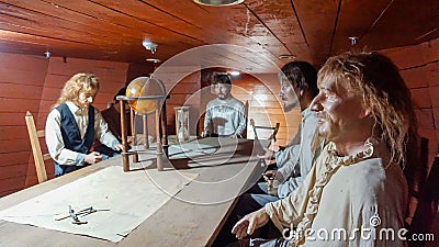 Installation of wax figures of the crew of an old sailing ship in the hold of the ship museum Editorial Stock Photo