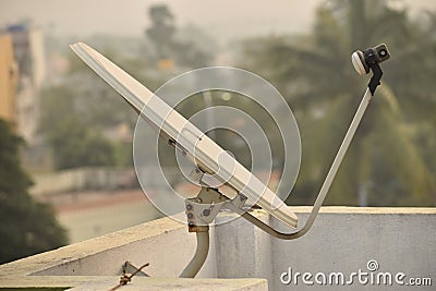 Installed dish or DTH or Direct to home tv on the roof, which is used for receiving TV programs Stock Photo