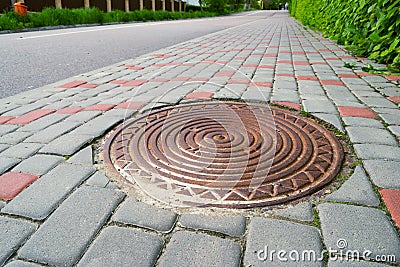 installed sewer hatch on the sidewalk Stock Photo