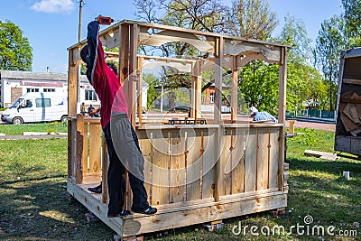 Installers build a pavilion of wood material Editorial Stock Photo