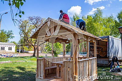 Installers build a pavilion of wood material Editorial Stock Photo