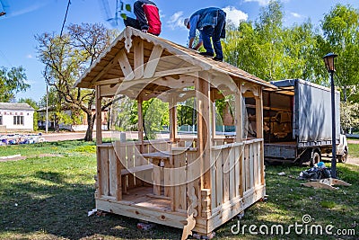 Installers build a pavilion of wood material Editorial Stock Photo