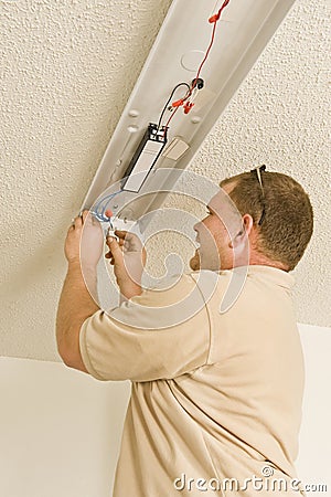 Installing Ballast In Fluorescent Light Fixture Royalty-Free Stock