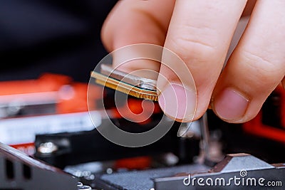 Installing computer hardware technician install CPU on motherboard Stock Photo