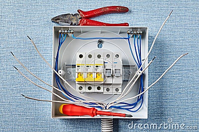 Installing of electric panel with automatic fuses Stock Photo