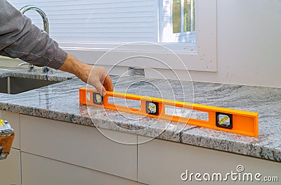 Installing with granite countertops renovation and granite kitchen interior cabinet Stock Photo