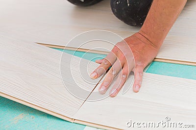 Installing laminate floor with wooden texture Stock Photo