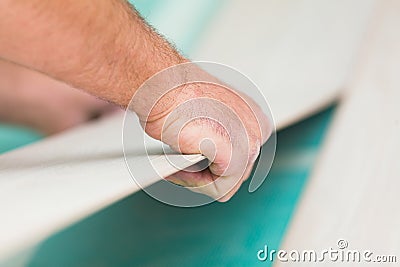 Installing laminate floor with wooden texture Stock Photo