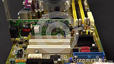 Installing a network card on the motherboard. Network data transmission system via wire. Many different chips. View of Stock Photo