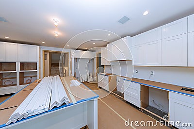 Installing new in modern kitchen of installation base for island in center Stock Photo