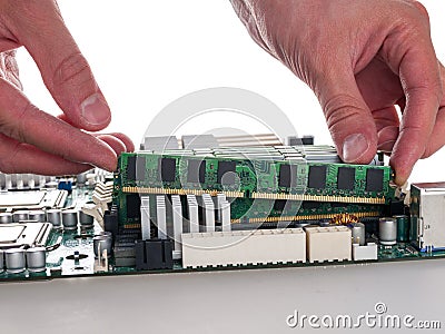 installing RAM modules in the computer motherboard, replacing and repairing computer components, increasing the amount of random a Stock Photo