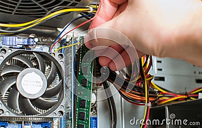 Installing RAM into the motherboard Stock Photo