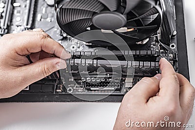 Installing random access memory into PC. Stock Photo