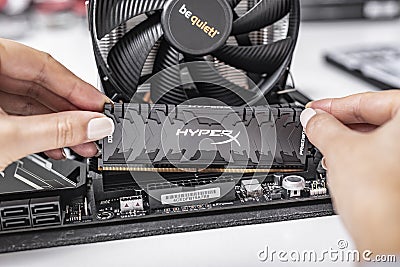 Installing random access memory into PC. Editorial Stock Photo
