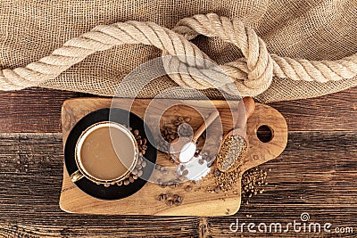 Instant granulated coffee. Coffee beans on or instant granulated coffee. Dry instant coffee in a black ceramic dish next to coffee Stock Photo