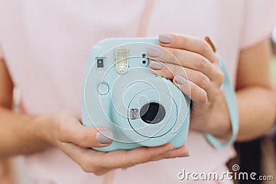 Instant print camera blue hands girl manicure Stock Photo