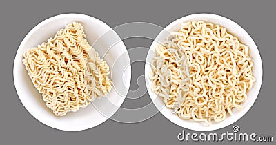 Instant ramen, dried block and soaked, in white bowls over gray Stock Photo