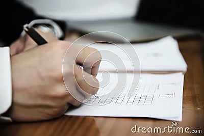 Instructor checking multiple choices answer sheet exam Stock Photo