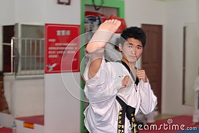 Instructor demonstration action-Taekwondo training hall Editorial Stock Photo