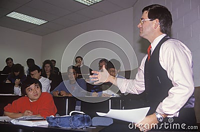 Instructor lecturing to and adult business class Editorial Stock Photo