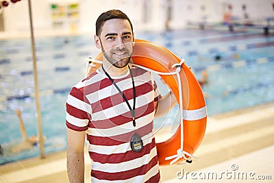 Instructor with lifebuoy Stock Photo