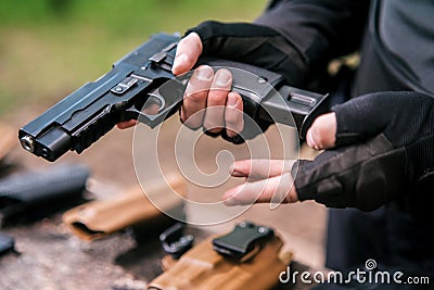 Sports shooting instructor check your weapons close-up Stock Photo