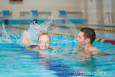 Instructor teaches the girl swimming in a pool Stock Photo