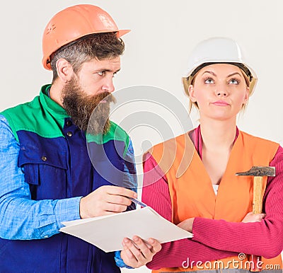 Insubordination concept. Man and woman in helmets Stock Photo