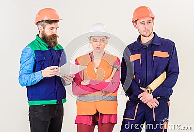 Insubordination concept. Men and woman in helmets Stock Photo