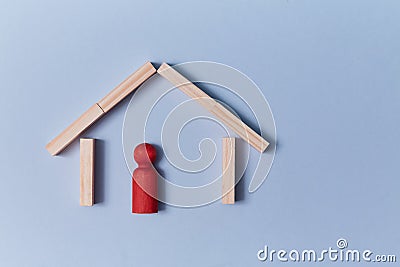 Insularity and cliquishness. Unfrequented, remote. Loneliness and isolation. Wooden house, lonely person figure inside Stock Photo