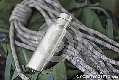 Insulated Stainless Bottle with climbing rope Stock Photo