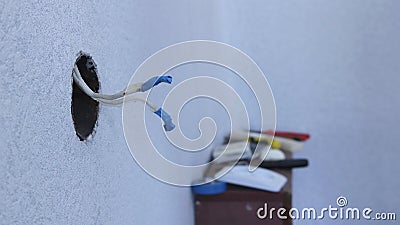 Insulated wires sticking out of the disassembled socket Stock Photo