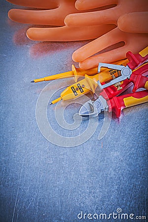 Insulating gloves hard hat electrical tester pliers nippers insu Stock Photo