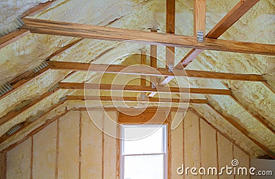 Insulation of attic with foam polyurea insulation cold barrier and insulation material Stock Photo