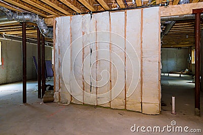 Insulation of basement with fiberglass cold barrier and insulation material Stock Photo