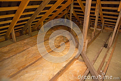 Insulation of the ceiling with fiberglass. Roof insulation. Laying and insulation with stone wool and fiberglass insulation Stock Photo