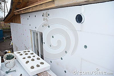 Insulation House Wall with styrofoam insulation sheets outdoor. Wall insulation with foam board. Stock Photo