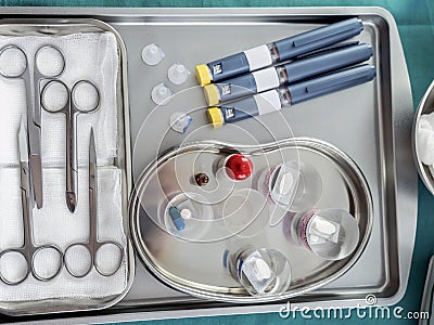 Insulin pens and medication prepared for delivery in a hospital Stock Photo